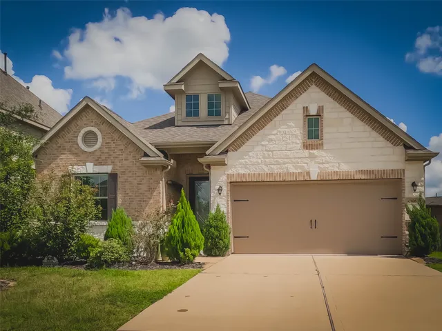 a couple of potted plants in front of door