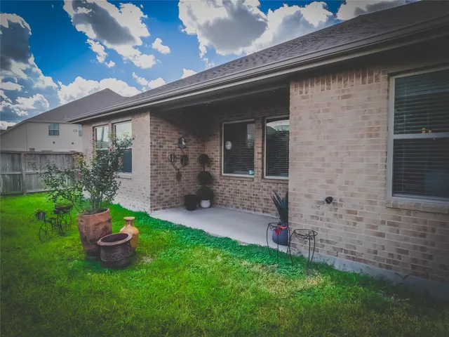 a front view of a house with a garden and porch