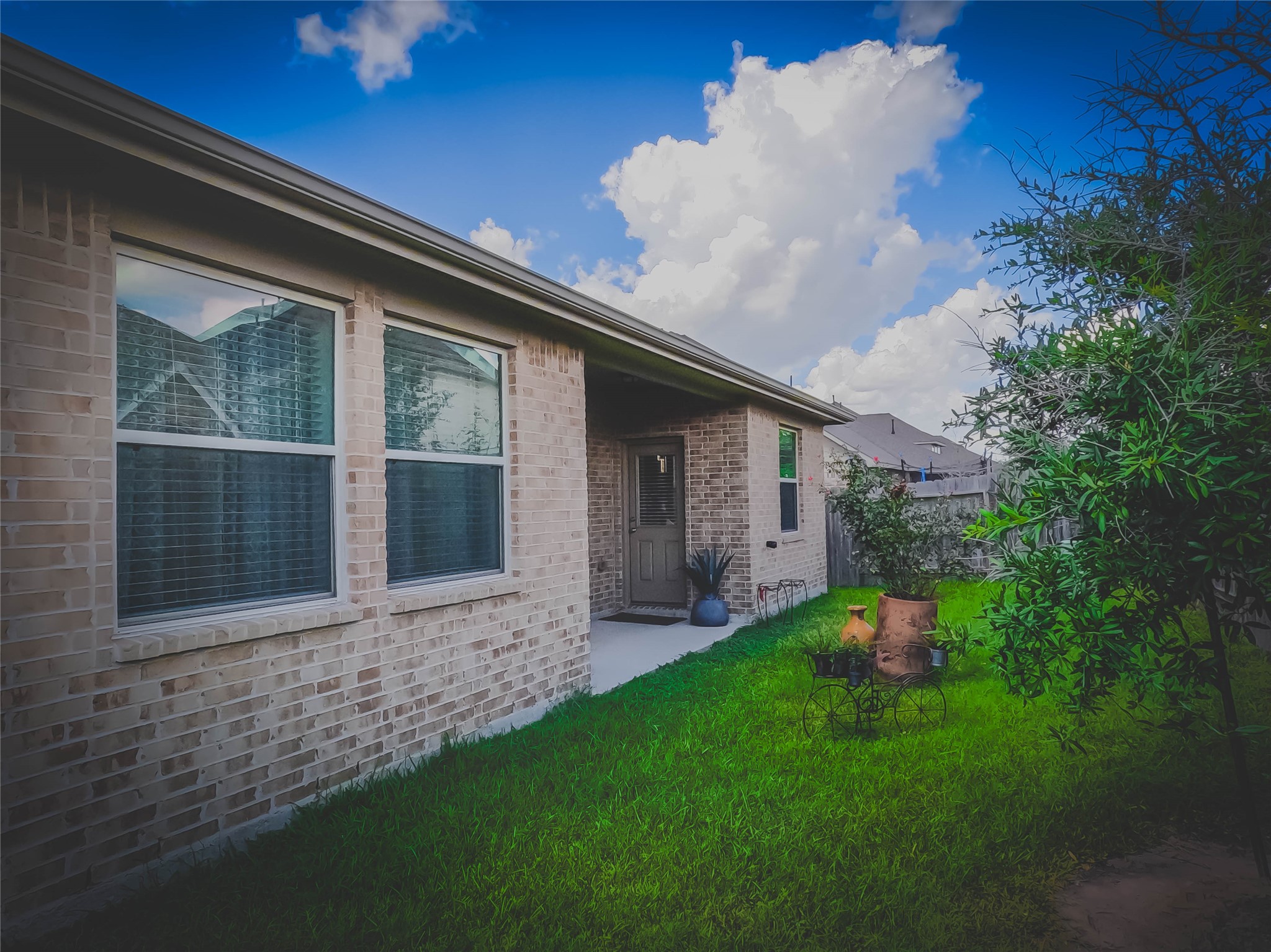 4306 Sandhill Terrace Lane Katy, TX 77493 - Photo 45 of 45 a front view of a house with a garden and porch