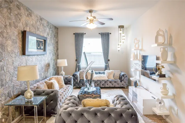 a living room with furniture and wooden floor