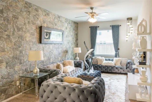 a bedroom with furniture and a large mirror