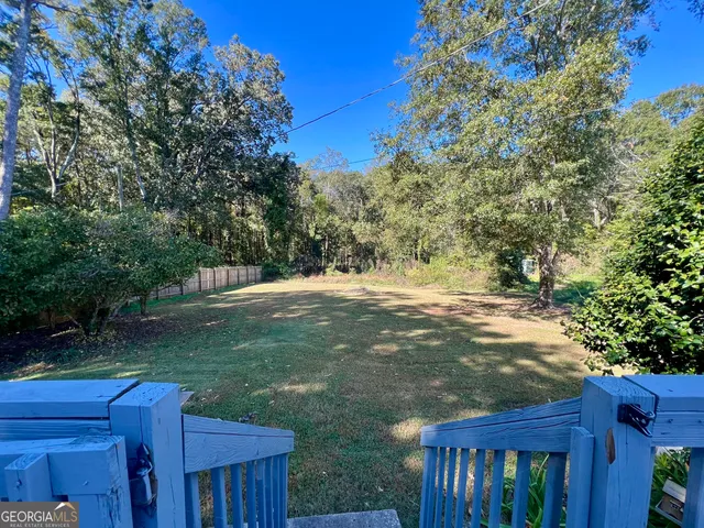 a view of backyard with green space