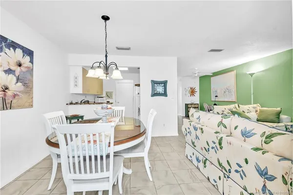 a kitchen with a stove a sink and a refrigerator