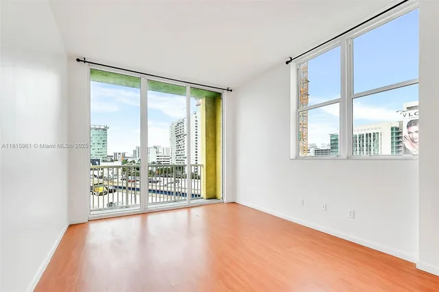 a view of an empty room with a window