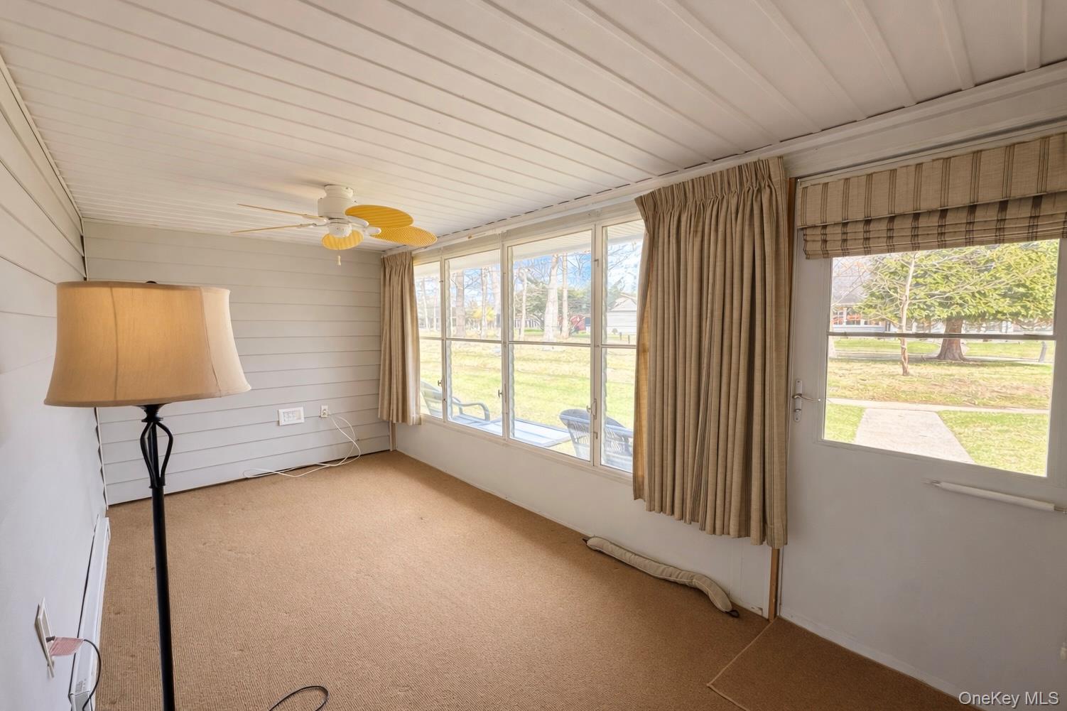 9 Guilford Court, Unit B Ridge, NY 11961 - Photo 4 of 12 a view of a room that has a window and a bed