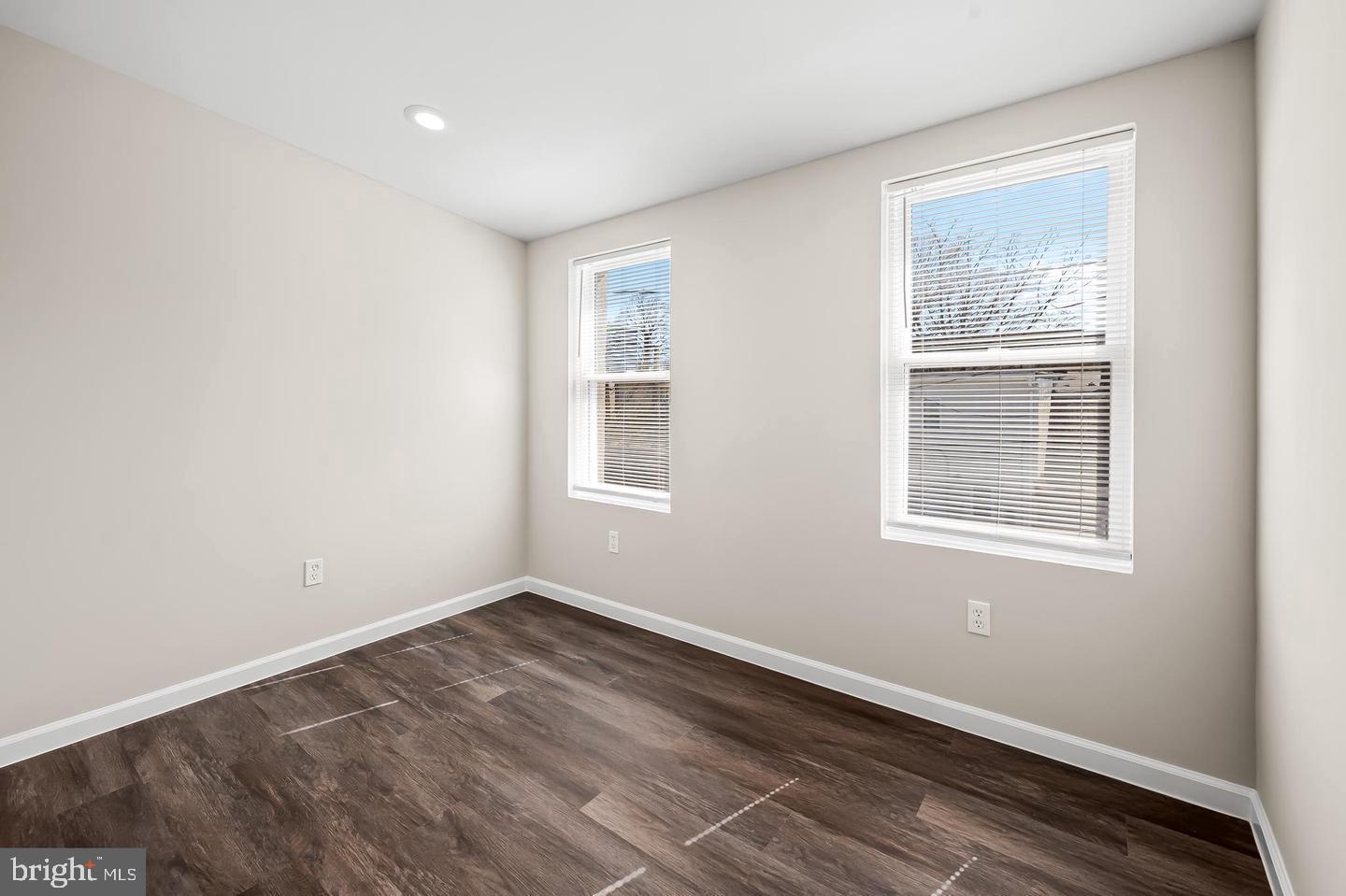 445 Pitman Place Baltimore, MD 21202 - Photo 15 of 29 a view of an empty room with wooden floor and a window