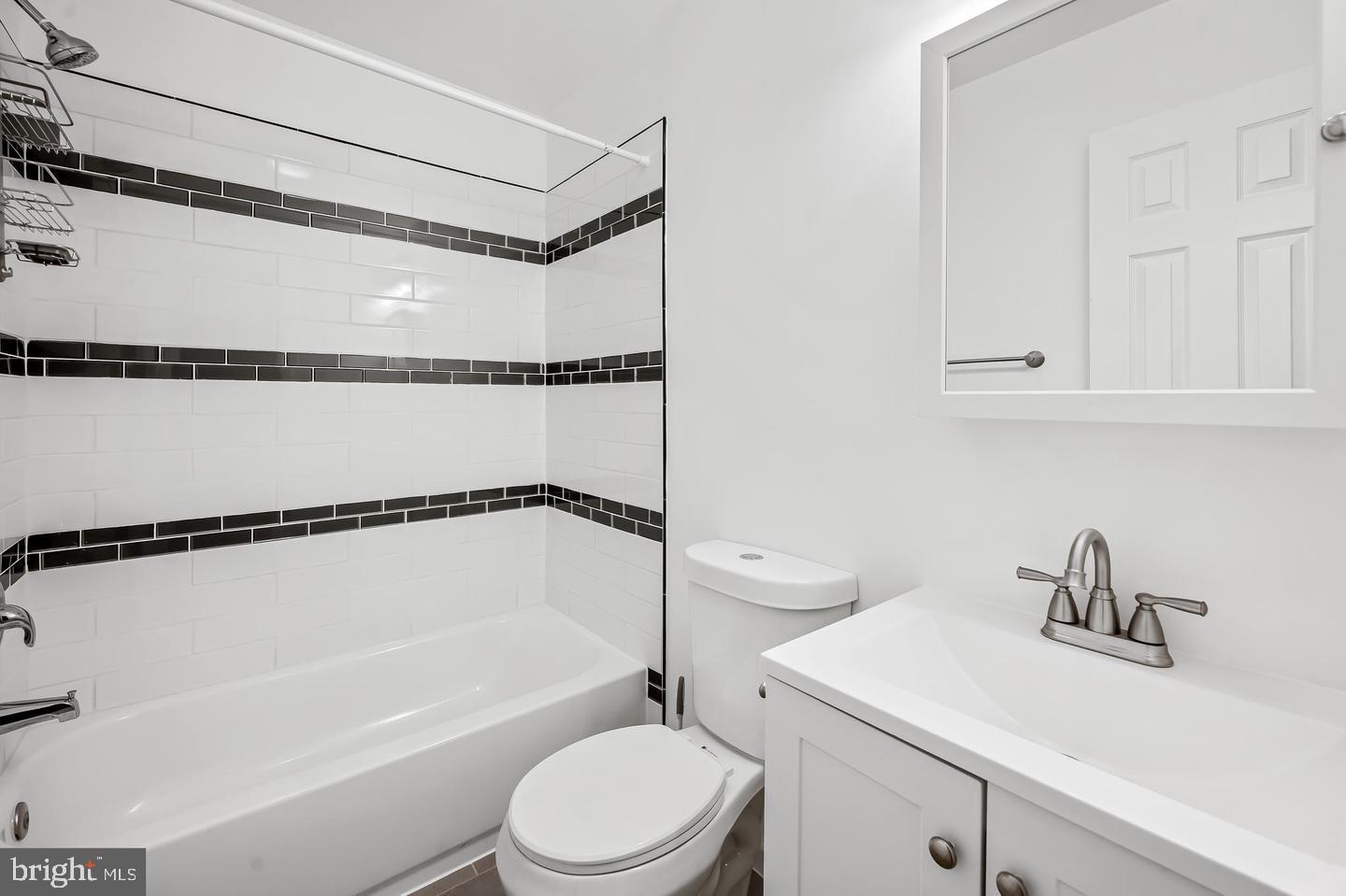 445 Pitman Place Baltimore, MD 21202 - Photo 18 of 29 a bathroom with a sink a toilet and shower