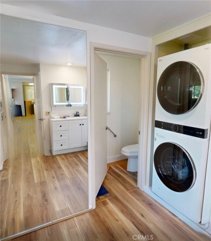 2143 Ronda Granada, Unit O Laguna Woods, CA 92637 - Photo 16 of 33 a view of a hallway with washer and dryer