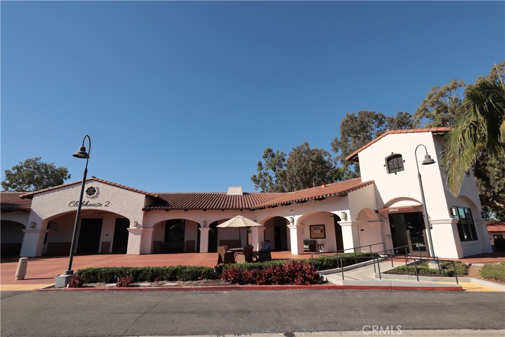 2143 Ronda Granada, Unit O Laguna Woods, CA 92637 - Photo 28 of 33 a front view of a house with yard