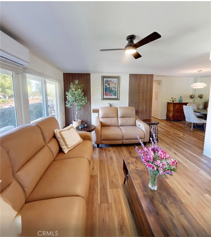 2143 Ronda Granada, Unit O Laguna Woods, CA 92637 - Photo 3 of 33 a living room with furniture or window and a wooden floor