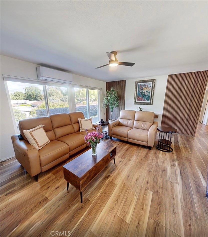 2143 Ronda Granada, Unit O Laguna Woods, CA 92637 - Photo 4 of 33 a living room with furniture and a large window
