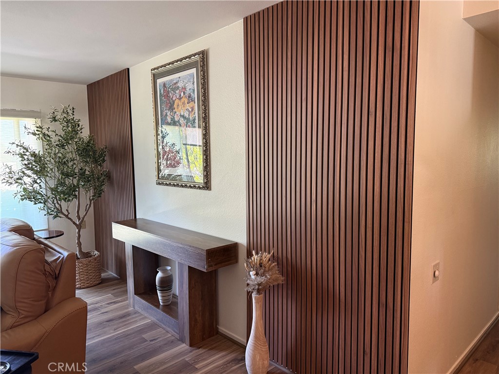2143 Ronda Granada, Unit O Laguna Woods, CA 92637 - Photo 5 of 33 a living room with furniture a fireplace and wooden floor