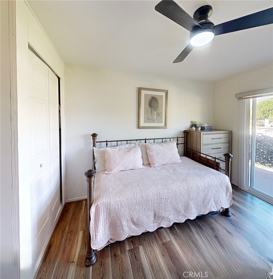 2143 Ronda Granada, Unit O Laguna Woods, CA 92637 - Photo 10 of 33 a bedroom with bed and wooden floor