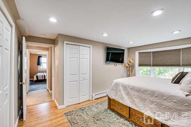 358 Old Post Road Edison, NJ 08817 - Photo 24 of 45 a bedroom with a large bed and a flat screen tv