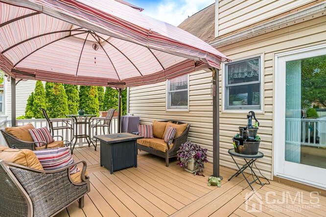 358 Old Post Road Edison, NJ 08817 - Photo 30 of 45 a balcony with furniture and wooden floor