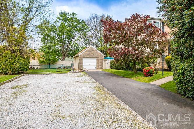 358 Old Post Road Edison, NJ 08817 - Photo 4 of 45 a view of a house with a yard and tree s