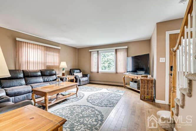 358 Old Post Road Edison, NJ 08817 - Photo 7 of 45 a living room with furniture and a flat screen tv