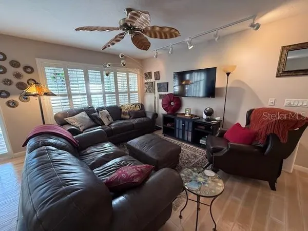 a living room with furniture and a large window