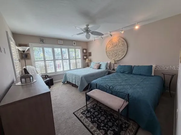 a bedroom with bed room and window