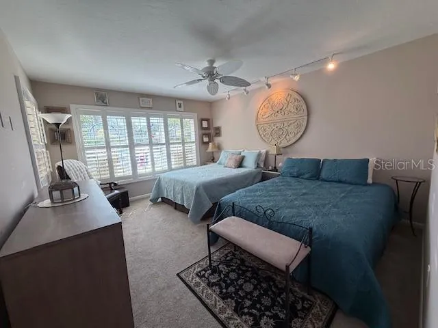 a bedroom with bed room and window