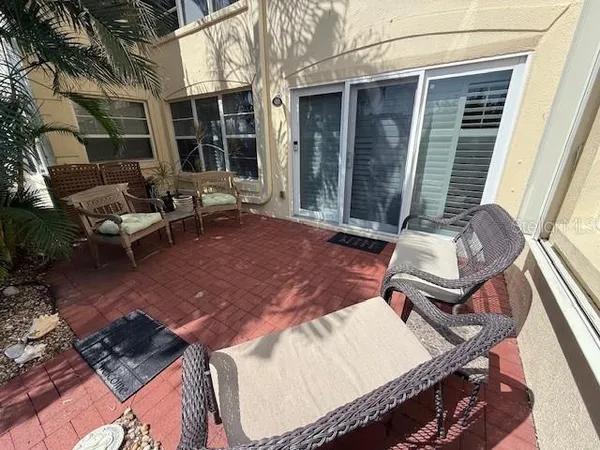 a backyard of a house with outdoor seating