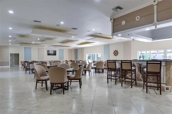 a group of people sitting at tables in a room