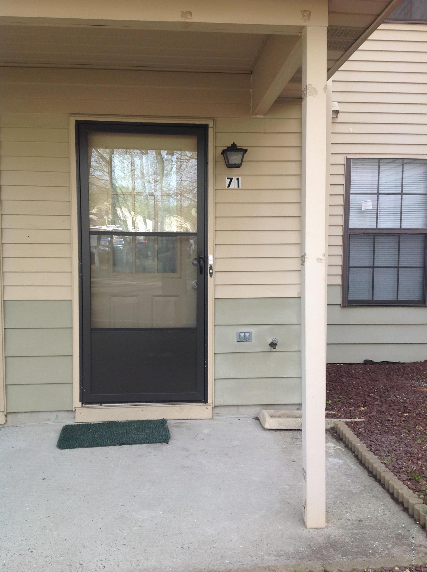 71 Azalea Circle Jackson, NJ 08527 - Photo 16 of 18 a view of a wooden door of the house