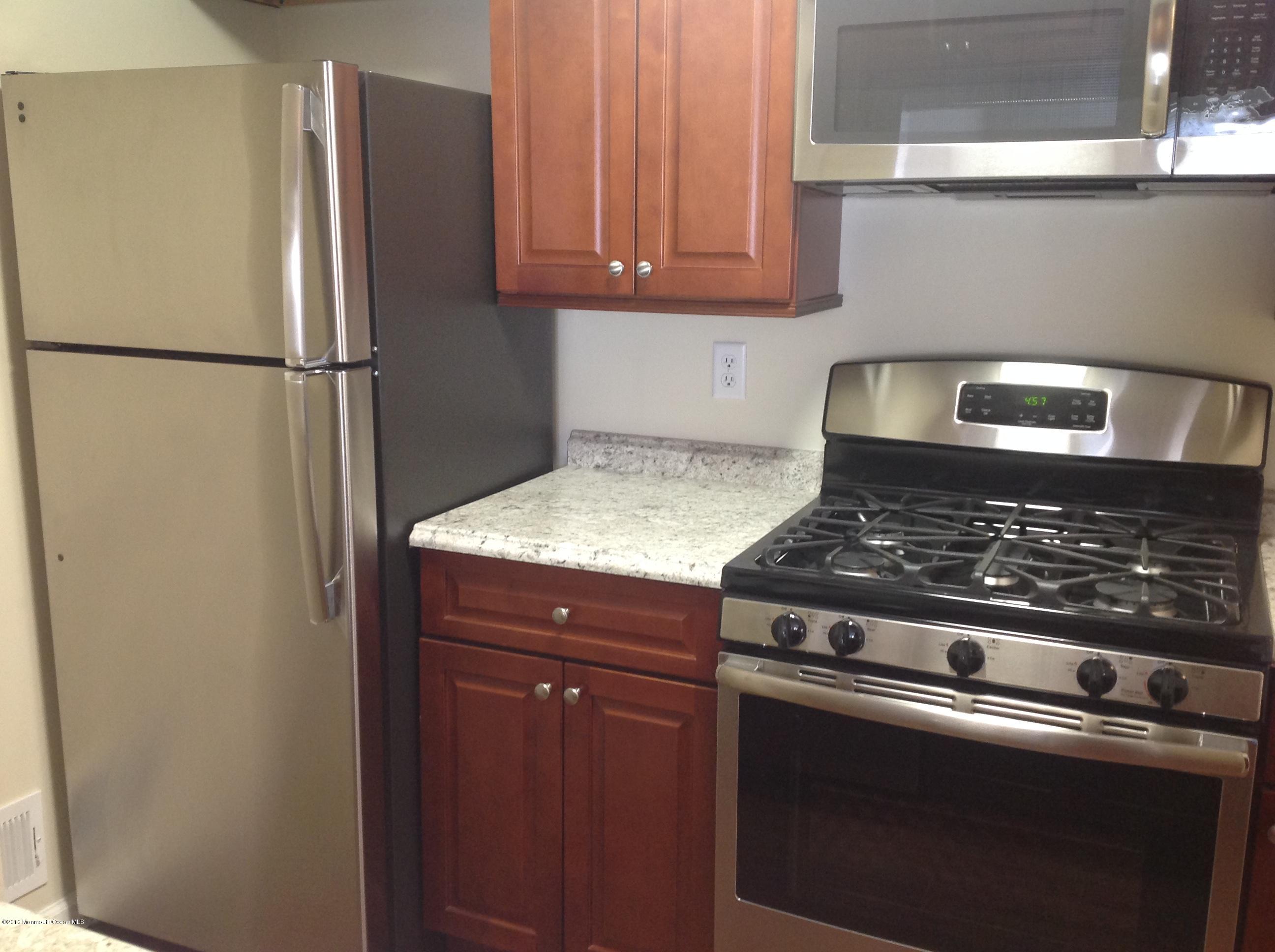 71 Azalea Circle Jackson, NJ 08527 - Photo 2 of 18 a stove top oven sitting inside of a kitchen