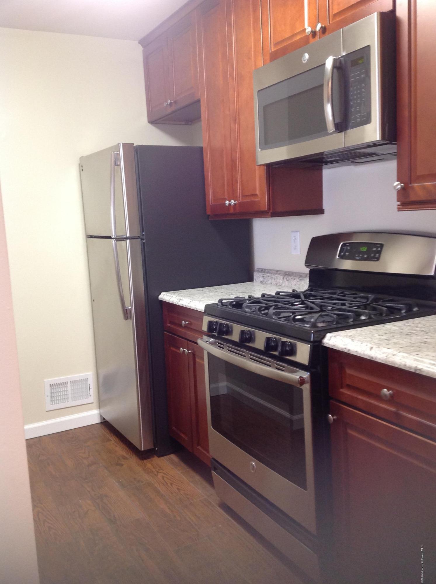 71 Azalea Circle Jackson, NJ 08527 - Photo 5 of 18 a kitchen with stainless steel appliances granite countertop a refrigerator stove and microwave