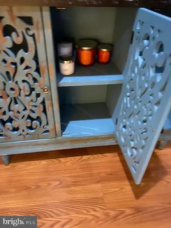 a kitchen with a refrigerator and a sink