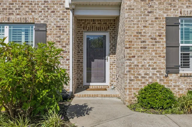 a front view of a house with a small yard