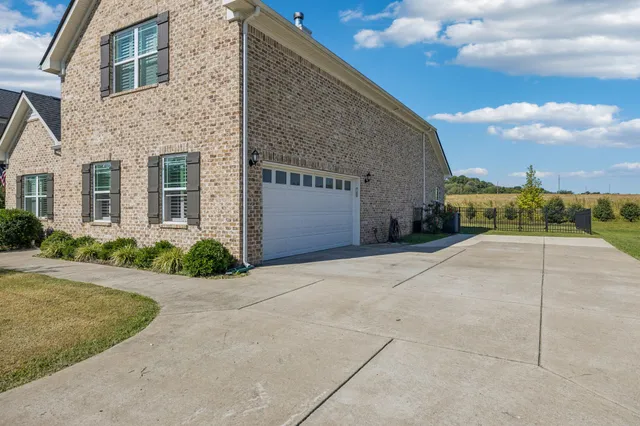 front view of a house with a garden