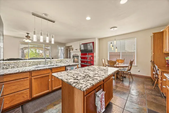 a view of a livingroom with furniture and a ceiling fan