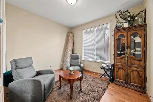 a bedroom with a bed and a table in it