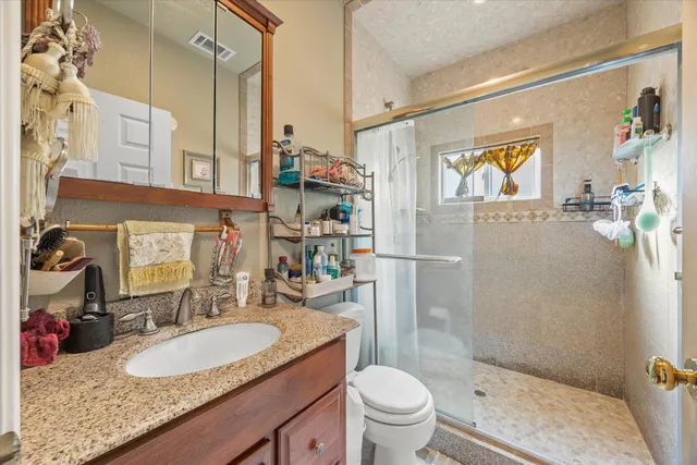 a white toilet sitting next to a shower curtain