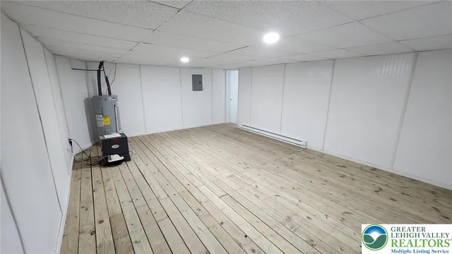 a view of a room with wooden floor and bathroom