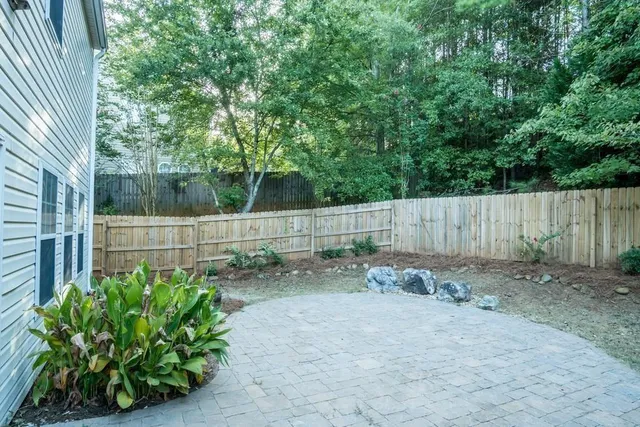 a backyard of a house with lots of green space