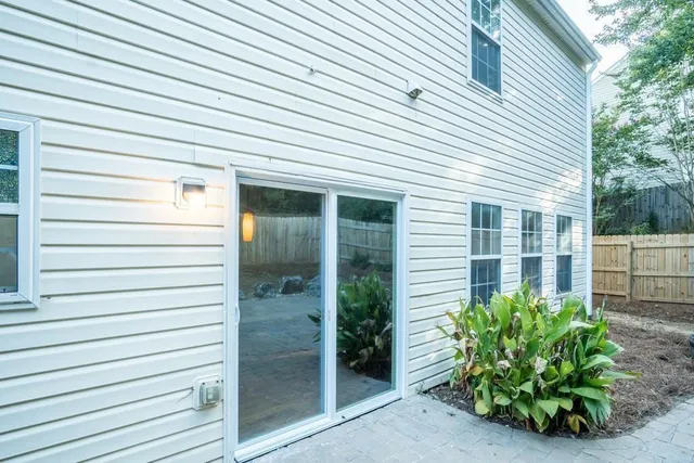 a view of a house with a potted plant
