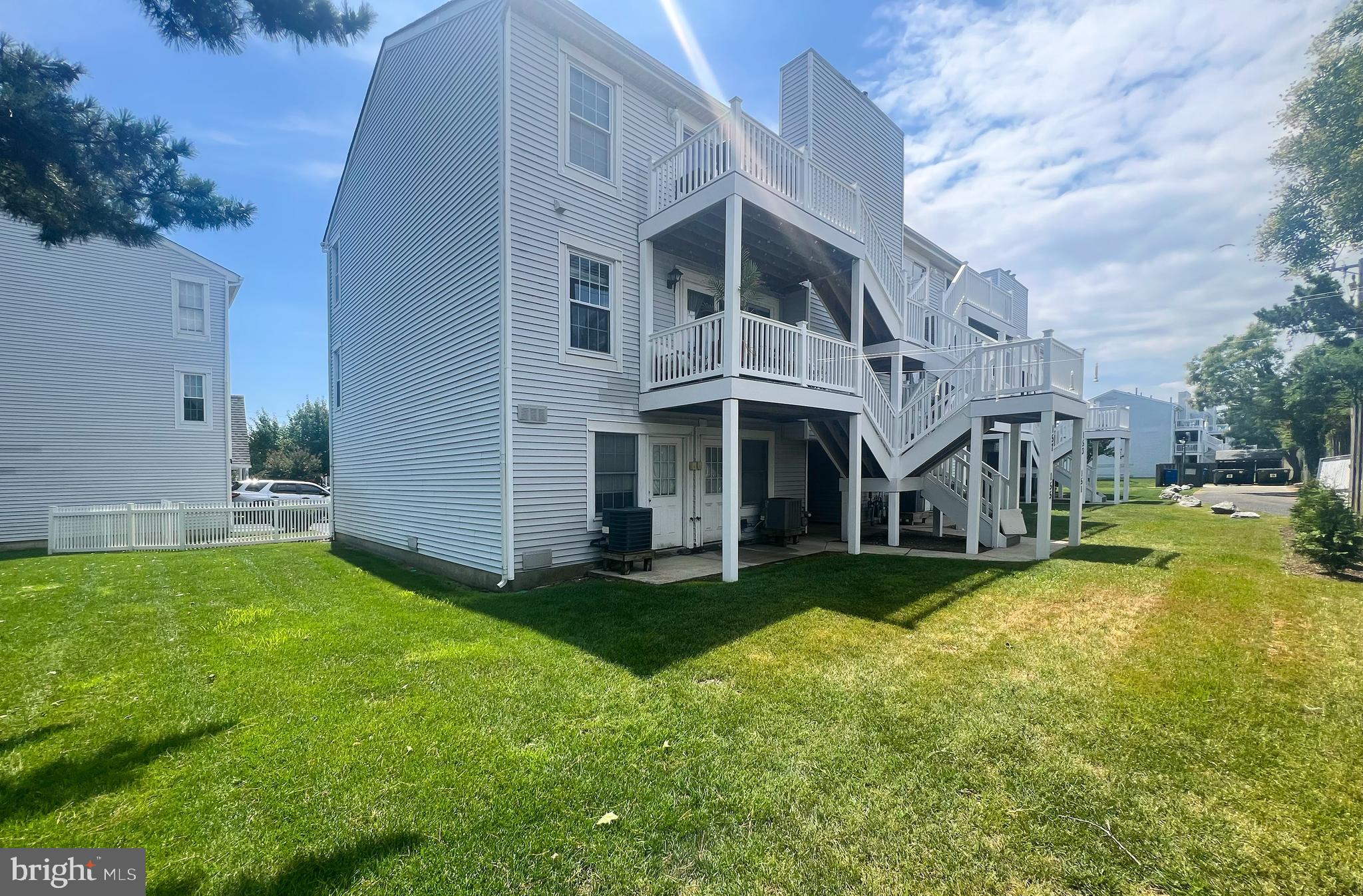 155 39th Street South Brigantine, NJ 08203 - Photo 17 of 17 a view of a house with a yard and sitting area