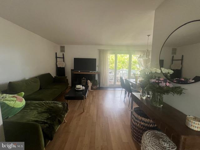 155 39th Street South Brigantine, NJ 08203 - Photo 2 of 17 a living room with furniture and a flat screen tv