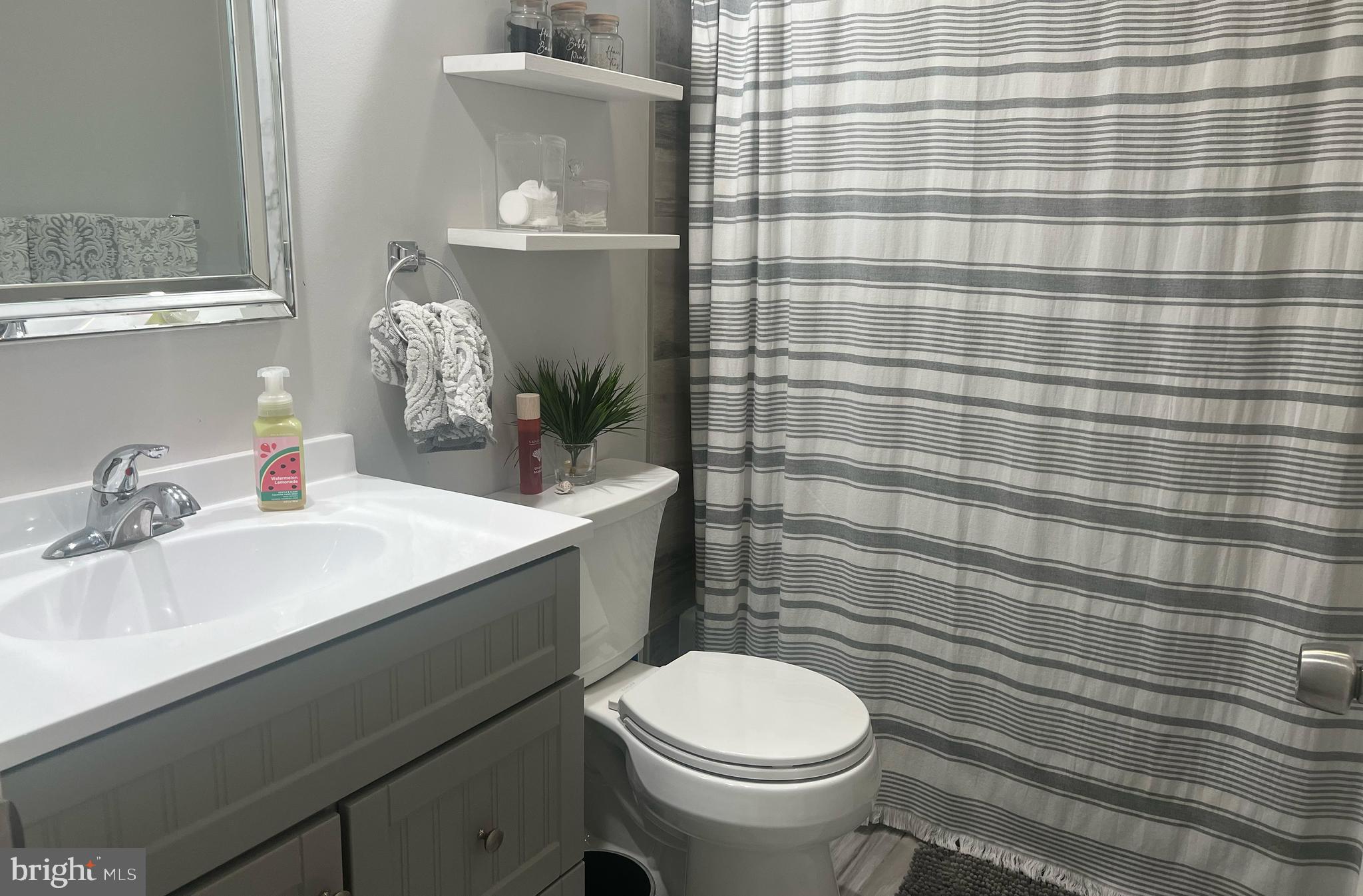 155 39th Street South Brigantine, NJ 08203 - Photo 7 of 17 a bathroom with a sink toilet and shower
