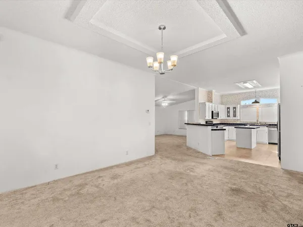 a view of a kitchen with a sink and cabinets
