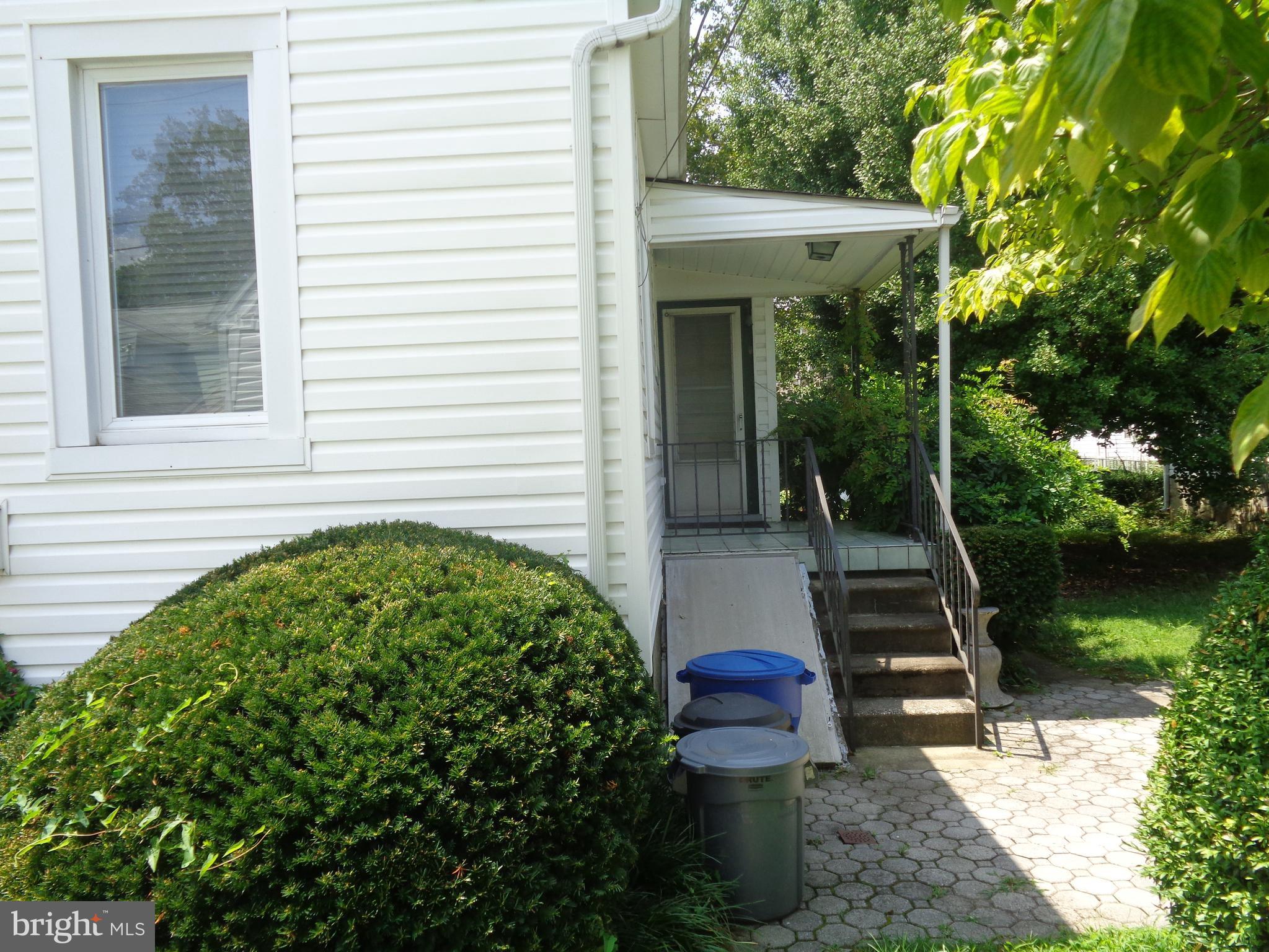 47 Broadship Road Baltimore, MD 21222 - Photo 2 of 27 a view of a chair and table in backyard of the house