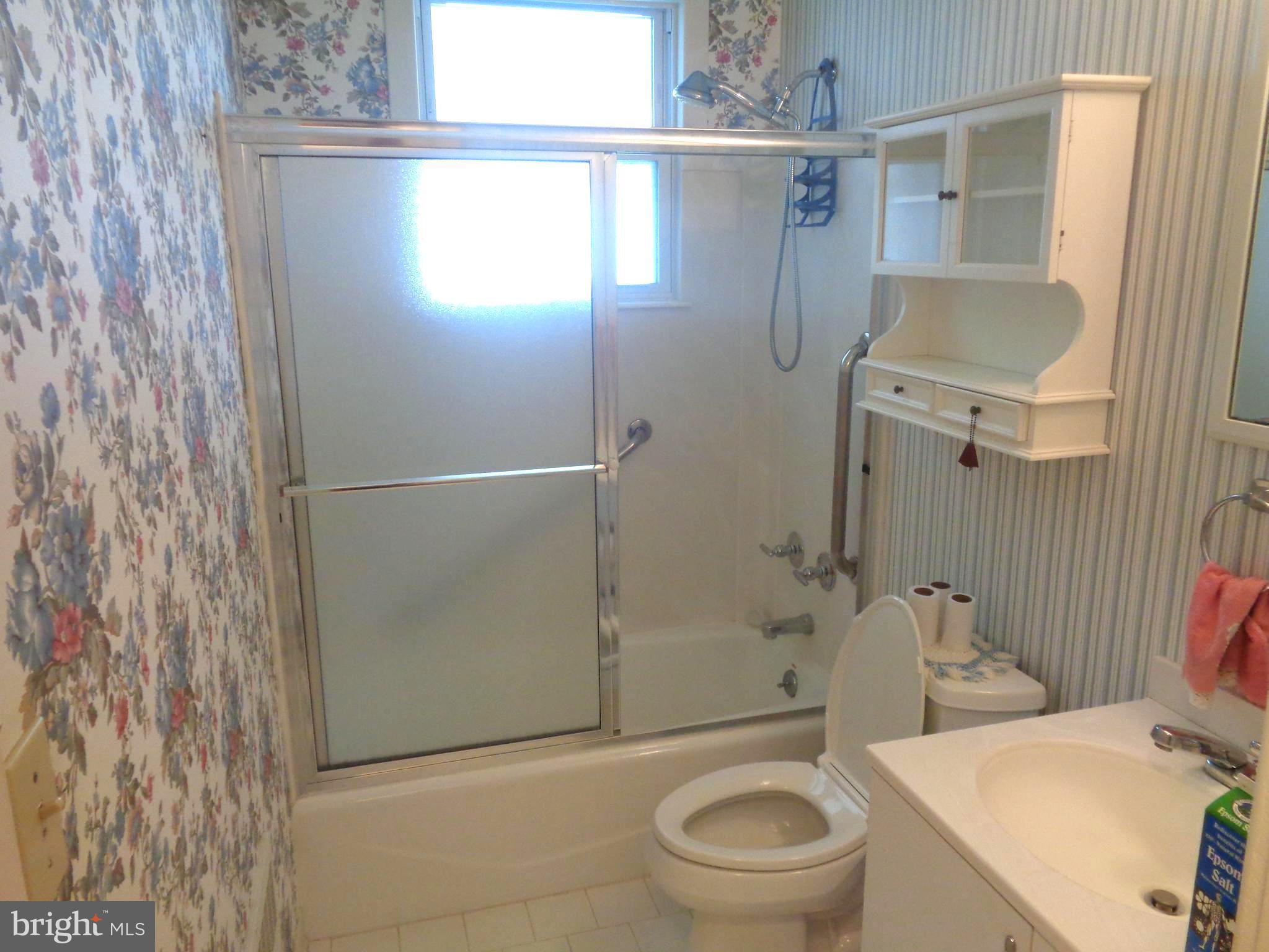47 Broadship Road Baltimore, MD 21222 - Photo 13 of 27 a bathroom with a granite countertop bathtub shower sink vanity and toilet