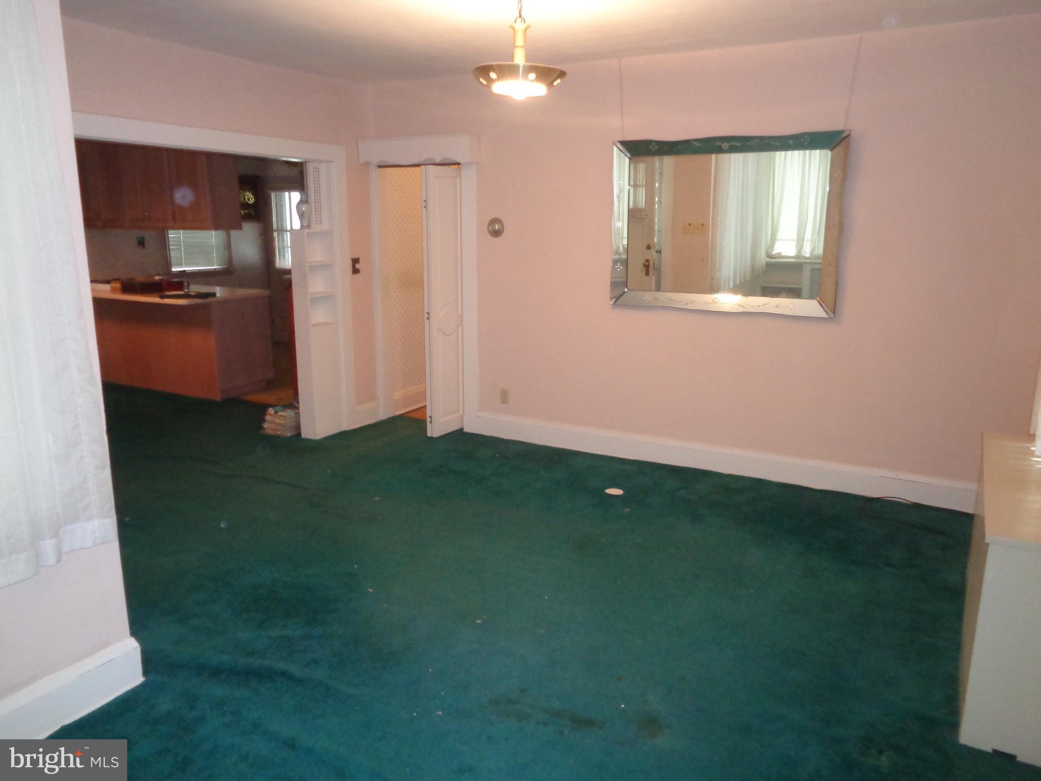 47 Broadship Road Baltimore, MD 21222 - Photo 15 of 27 a view of an empty room with kitchen and a window