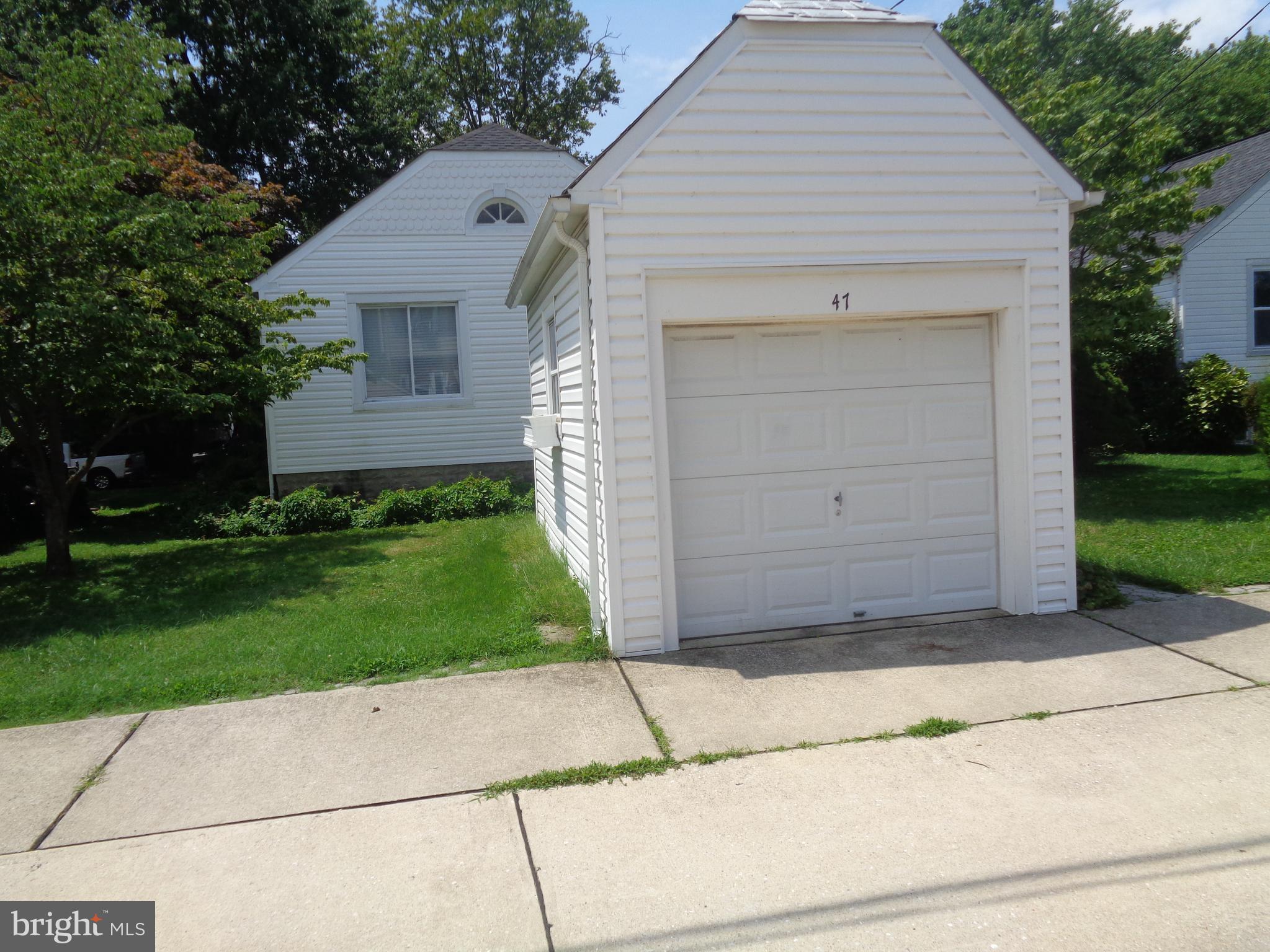 47 Broadship Road Baltimore, MD 21222 - Photo 22 of 27 a front view of a house with a garden
