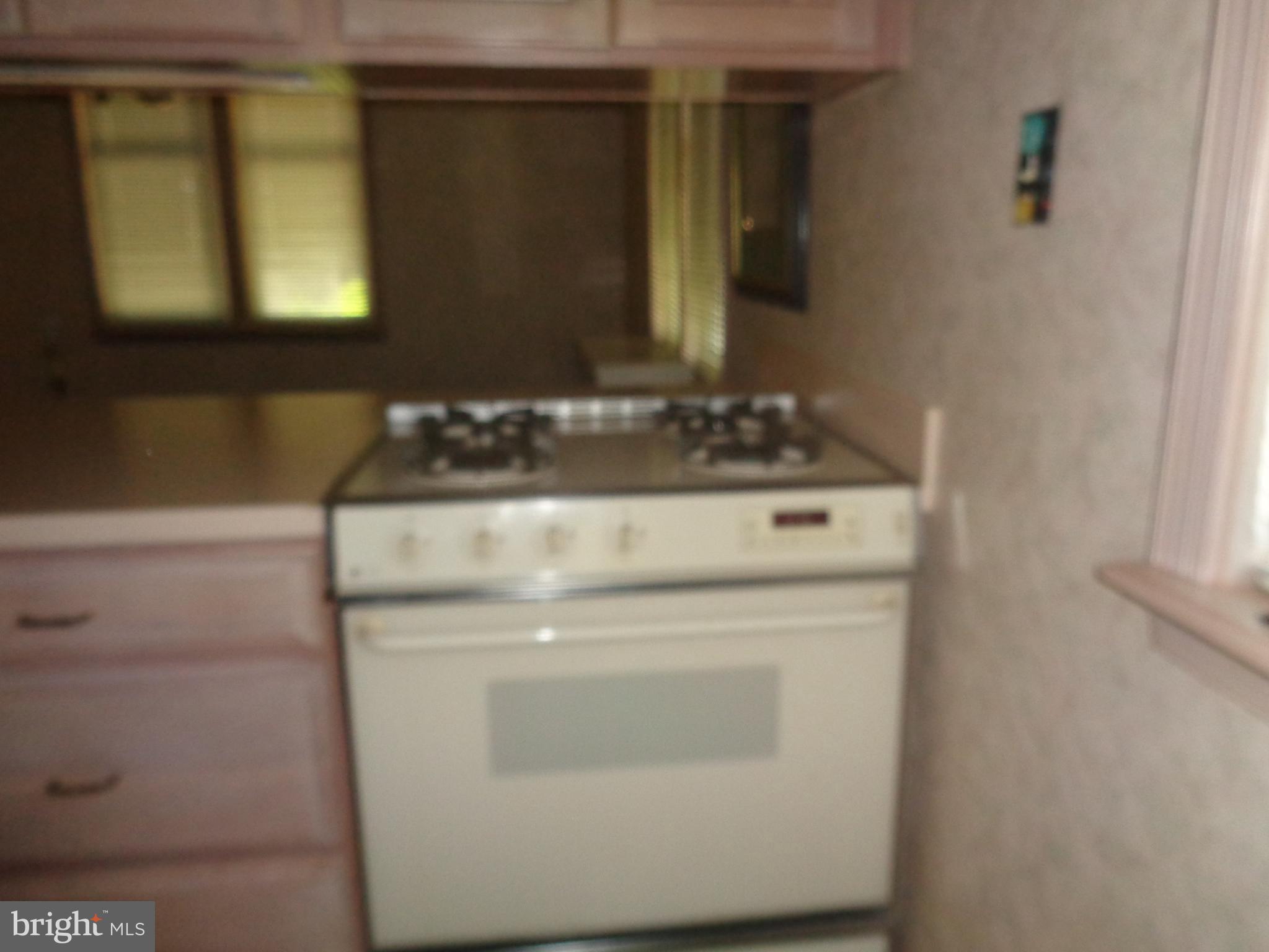 47 Broadship Road Baltimore, MD 21222 - Photo 25 of 27 a bathroom with a sink and a mirror