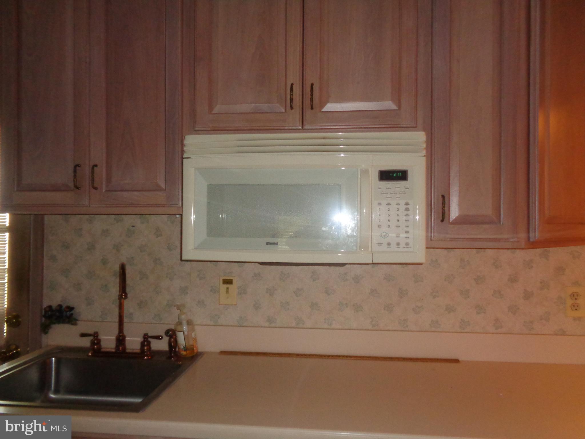 47 Broadship Road Baltimore, MD 21222 - Photo 26 of 27 a bathroom with a sink and cabinets