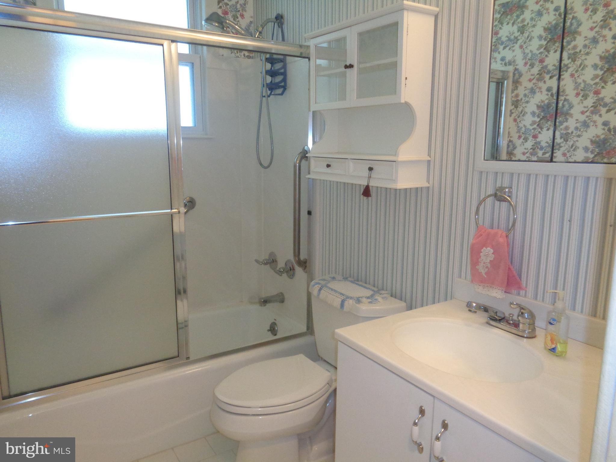 47 Broadship Road Baltimore, MD 21222 - Photo 27 of 27 a bathroom with a sink toilet and shower