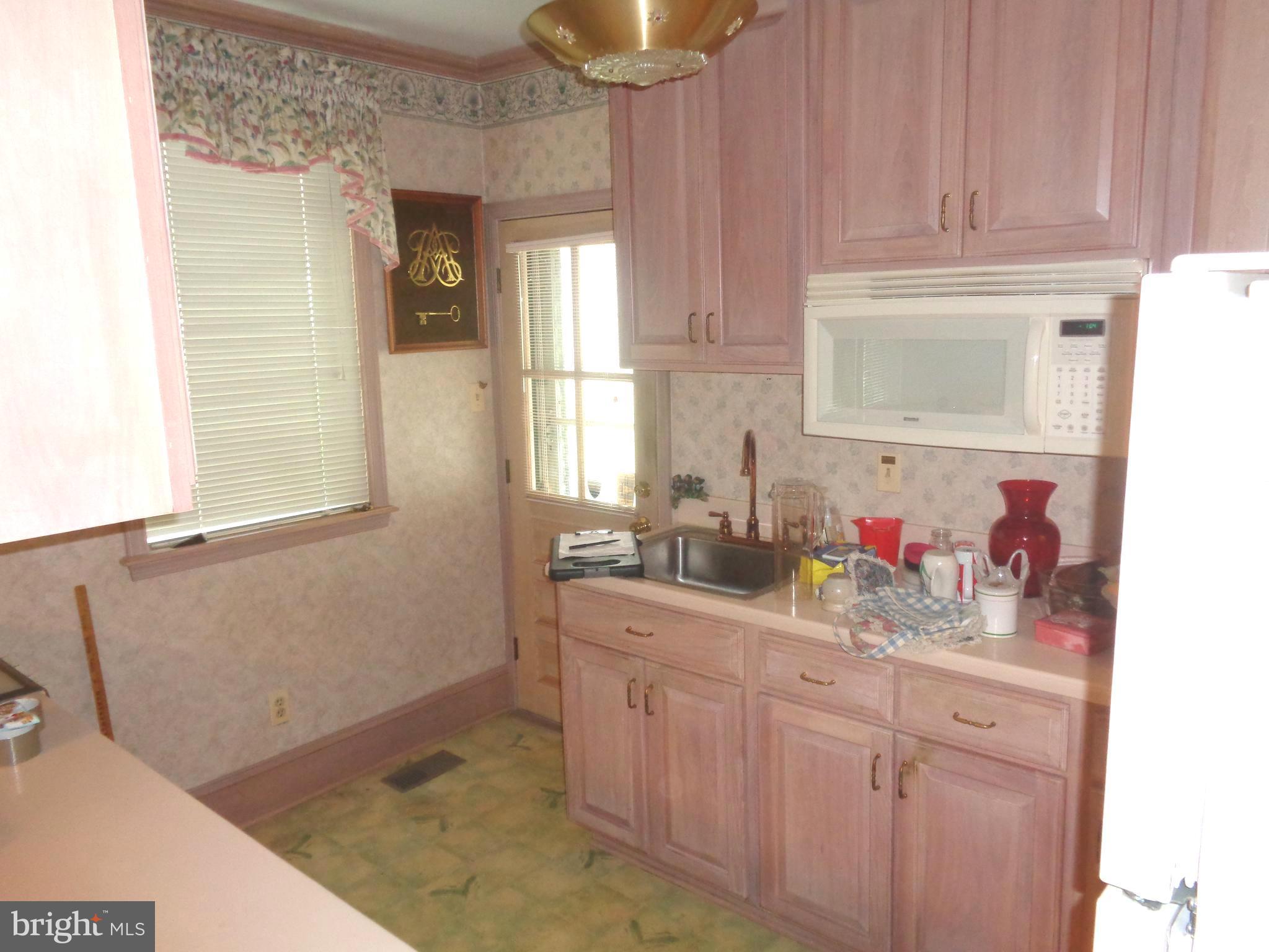 47 Broadship Road Baltimore, MD 21222 - Photo 6 of 27 a bathroom with a sink and a mirror